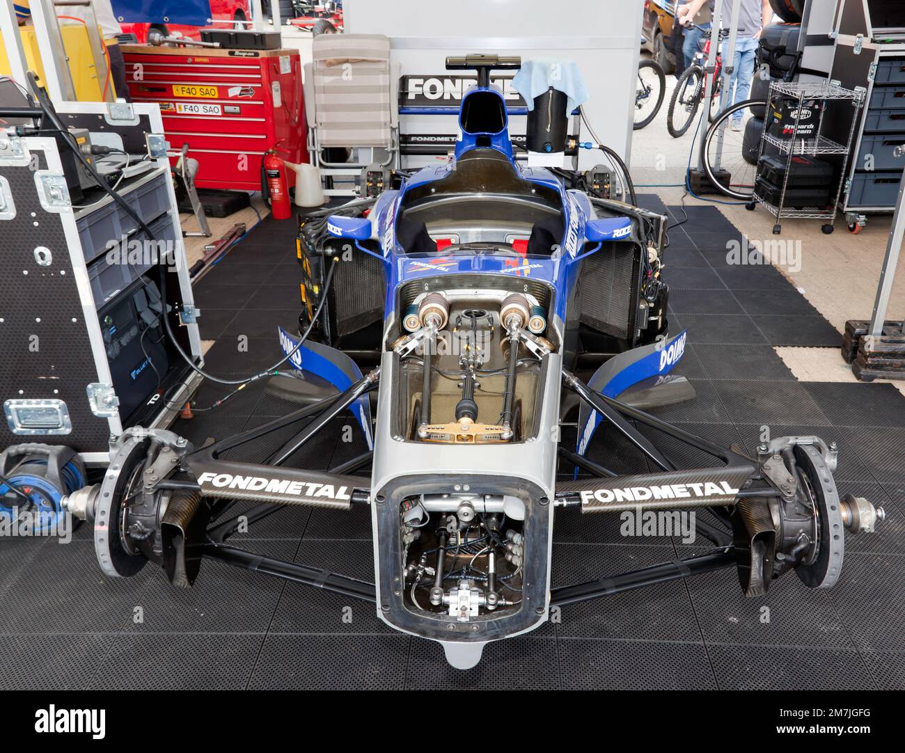Front view of the stripped-down monocoque chassis of the Minardi M198, on display at the 2022 Silverstone Classic Stock Photo