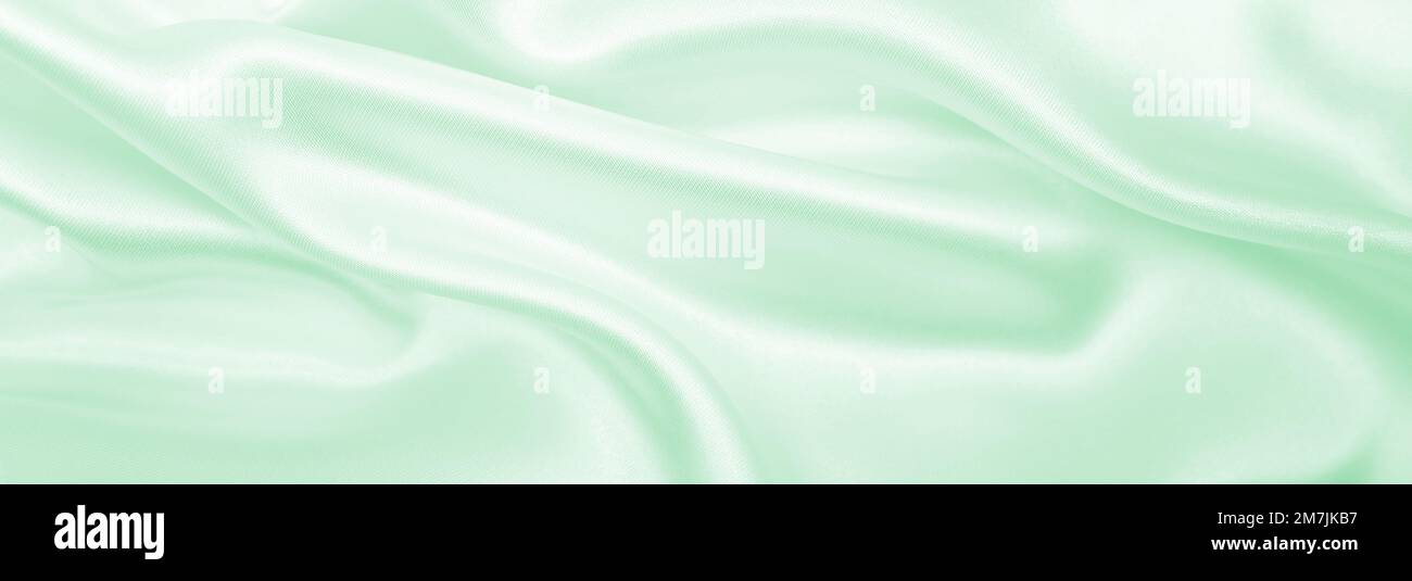 Smooth elegant green silk or satin luxury cloth texture can use as ...