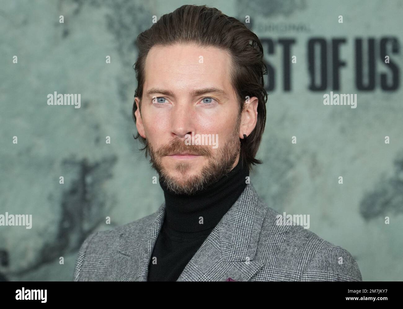 Troy Baker arrives at HBO's THE LAST OF US Premiere held at the Regency  Village Theater in Westwood, CA on Monday, ?January 9, 2023. (Photo By  Sthanlee B. Mirador/Sipa USA Stock Photo 