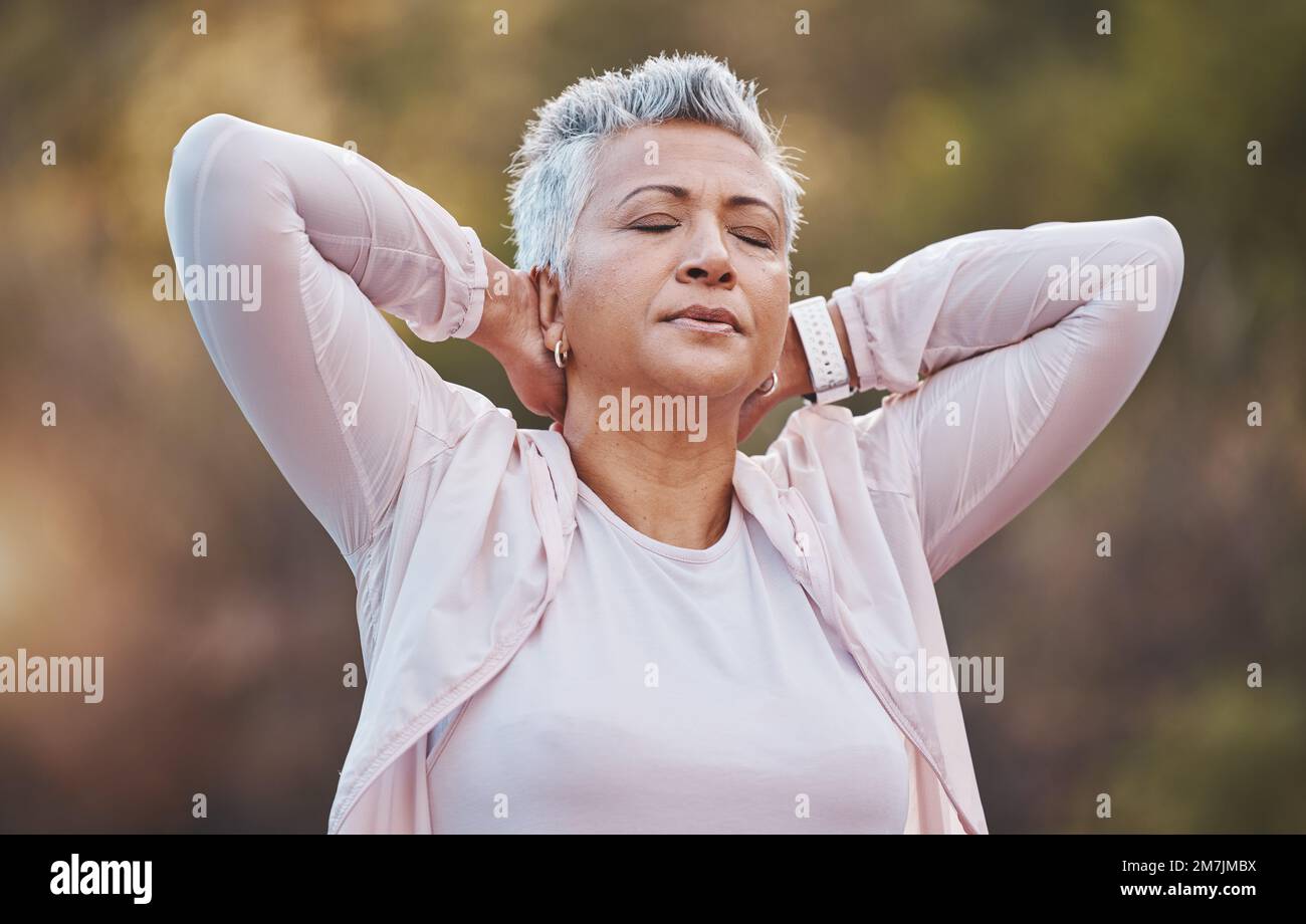 Senior woman, neck pain and tired for outdoor exercise and sports fitness or runner workout training in nature park. Mature athlete, cardio back pain Stock Photo
