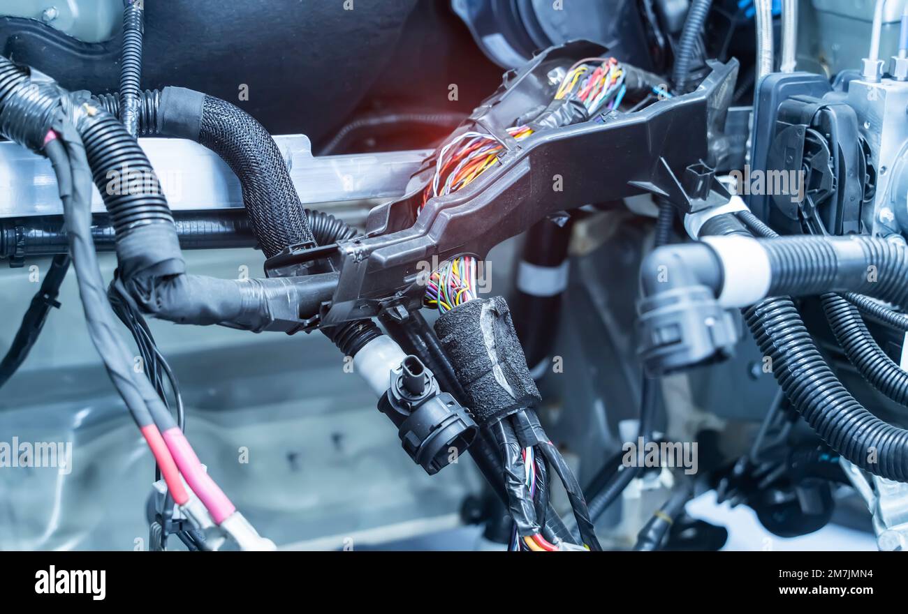 Large wide cable with wires and connectors and terminals in the wiring repair shop and