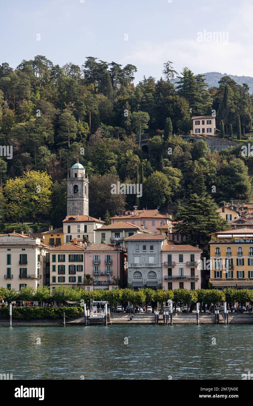 Waterfront Town Bellagio, Italy, Lake Como with Sailing Boat and Flowers Stock Photo