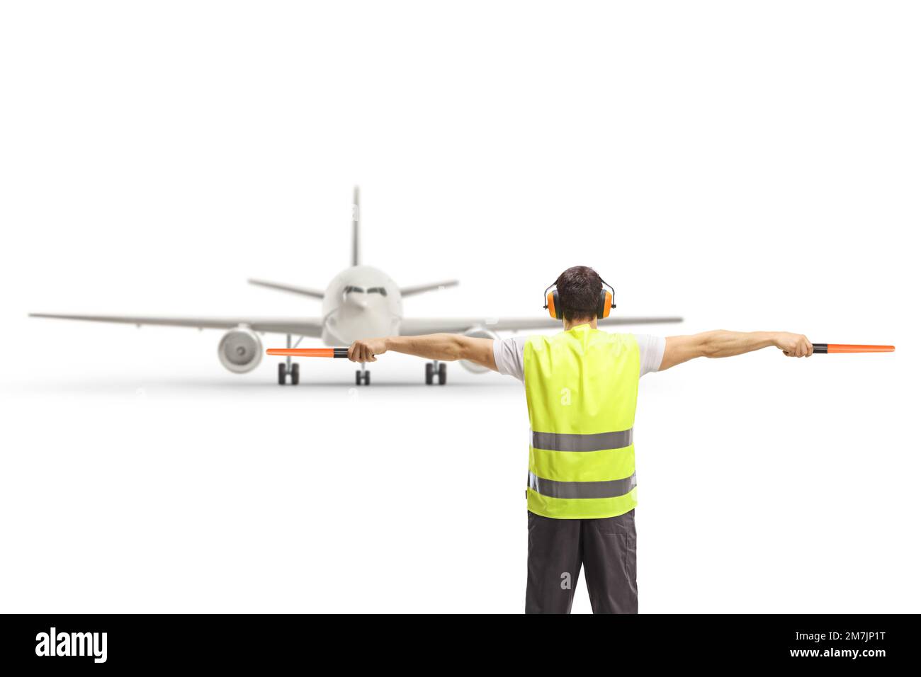 Back view of an marshaller signalling with wands in front of an