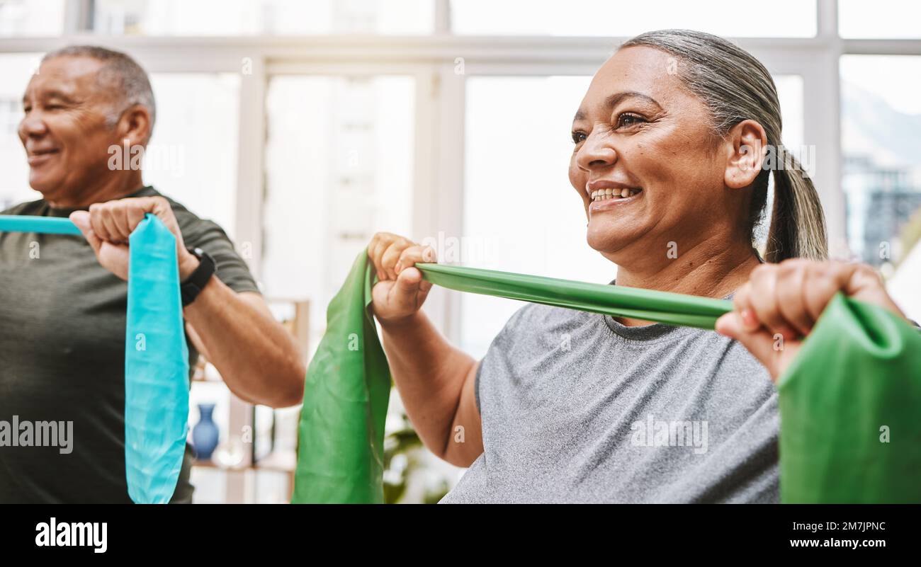 Physiotherapy, stretching band and senior couple with teamwork for muscle wellness, rehabilitation and support together. Elderly black people or Stock Photo