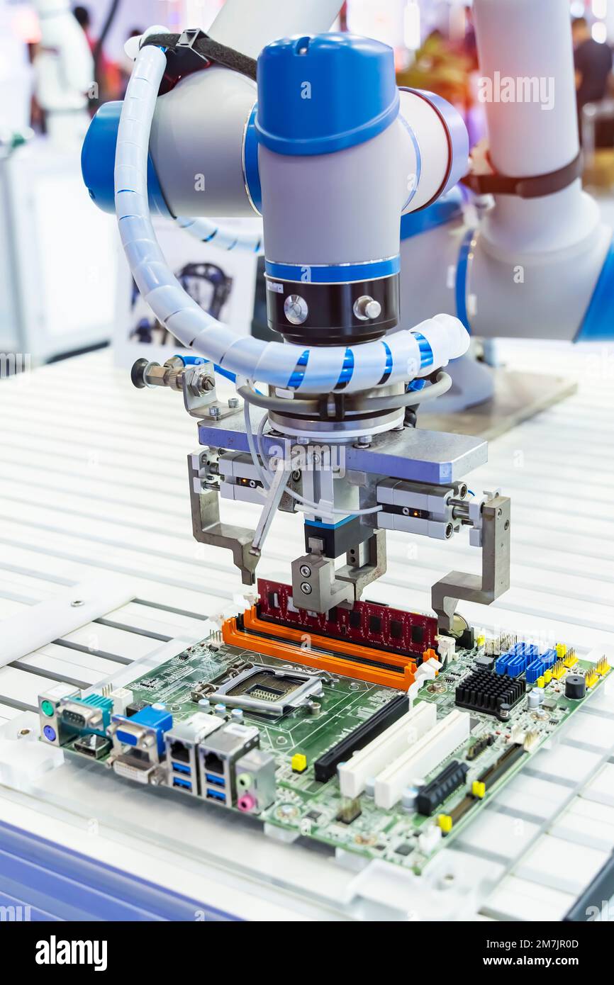 automatic arm installing a computer chip with ram Stock Photo - Alamy