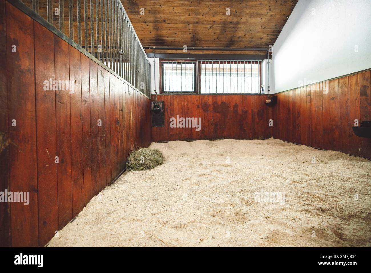 Large clean empty horse stable at the ranch Stock Photo
