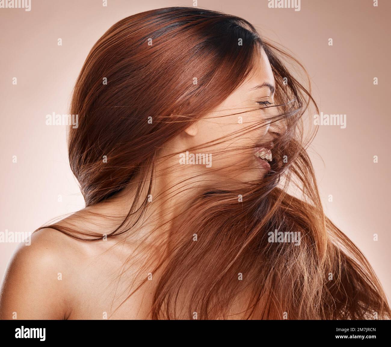 Shaking hair, beauty and cosmetics of a happy woman on studio background  for luxury keratin treatment with shampoo product. Headshot of female  posing Stock Photo - Alamy