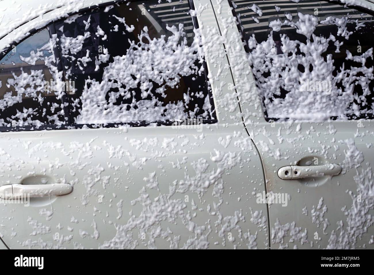 A spray foam car wash on body car to washing Stock Photo Alamy