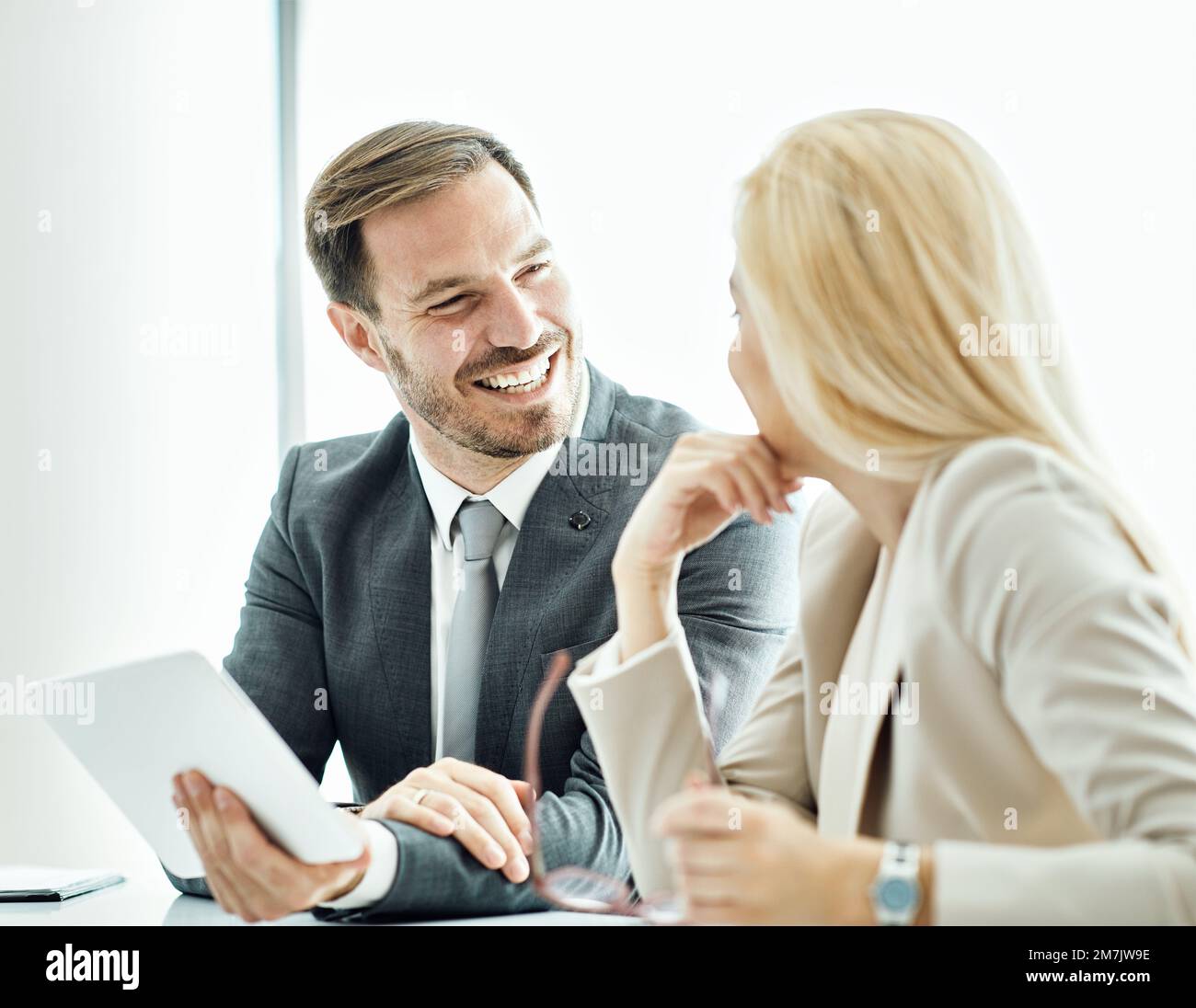 young business people meeting office teamwork success corporate discussion tablet businessman Stock Photo