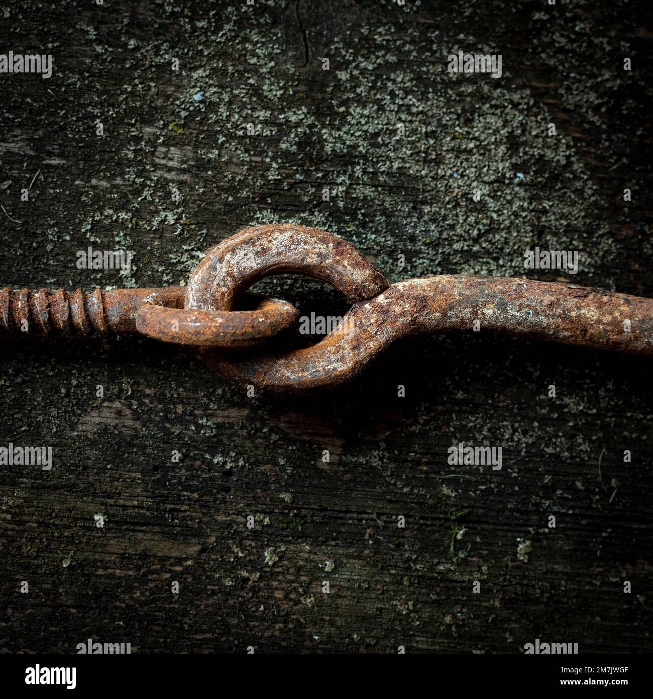 Top view of the rusty and old chain put on the grunge table surface Stock Photo
