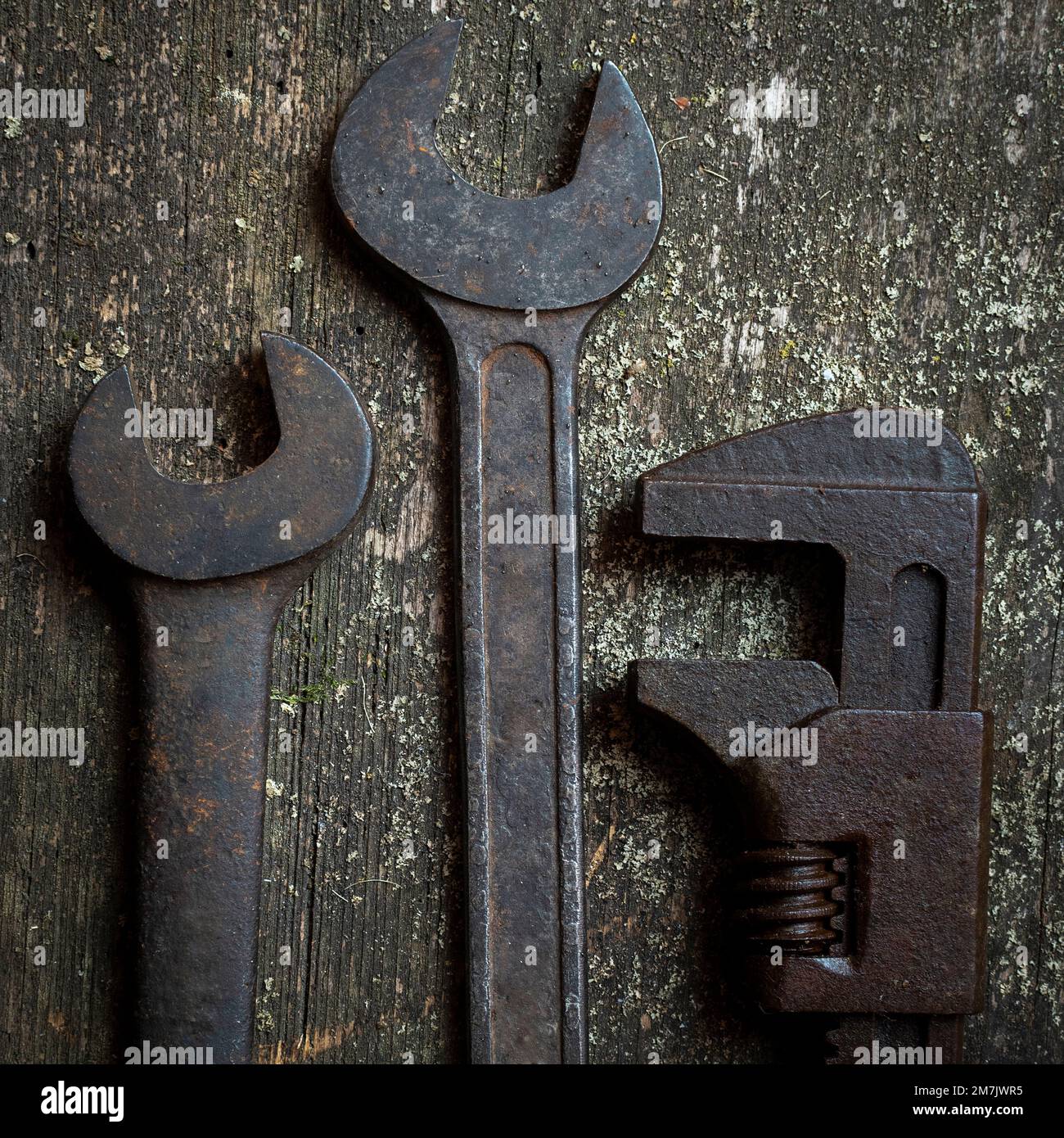 Top view of the rusty and old wrenches put on the grunge table surface