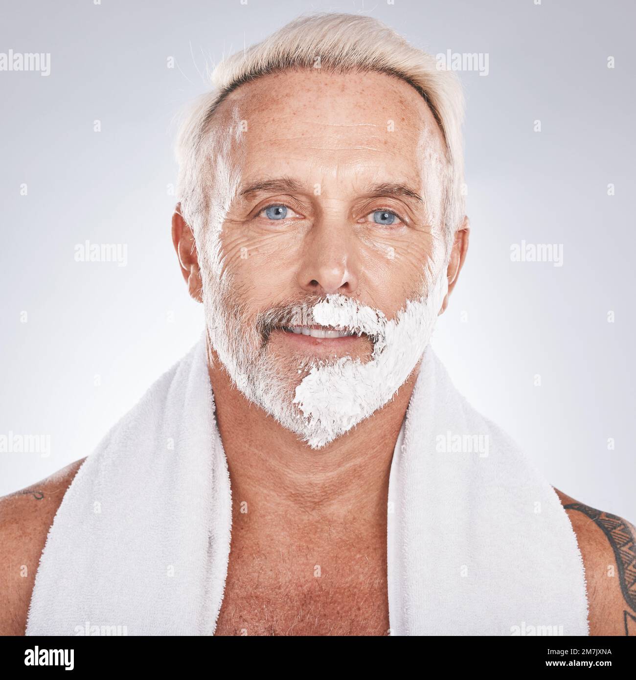 Man, face and grooming shaving cream in self care maintenance or beauty aesthetic on gray studio