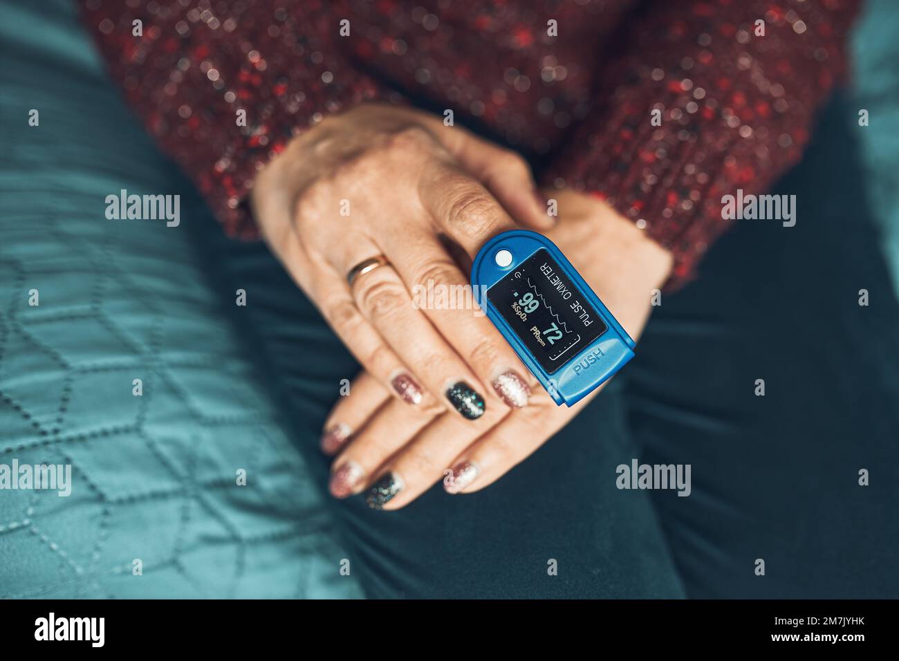 Woman measuring the degree of oxygen saturation of the blood and heart