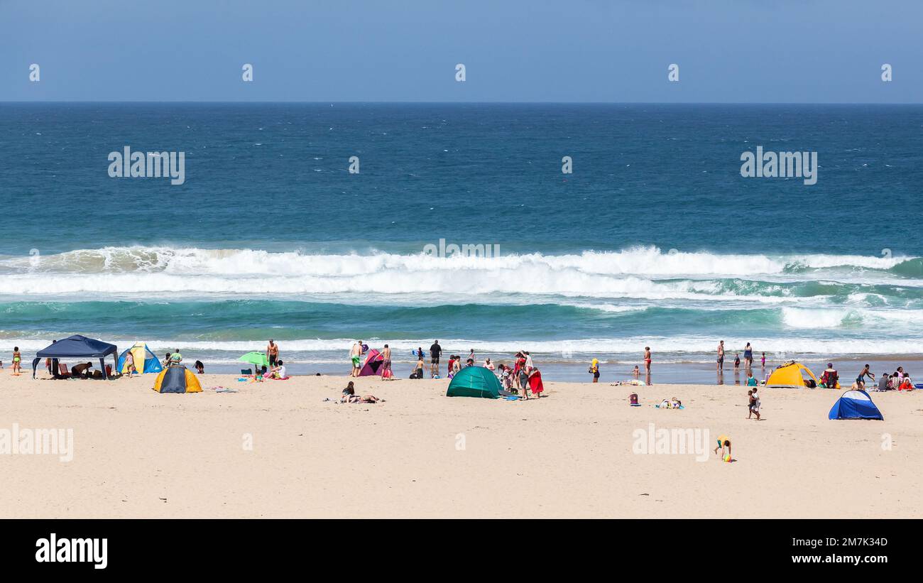 Beach blue ocean a summer holiday public  destination overlooking water landscape. Stock Photo