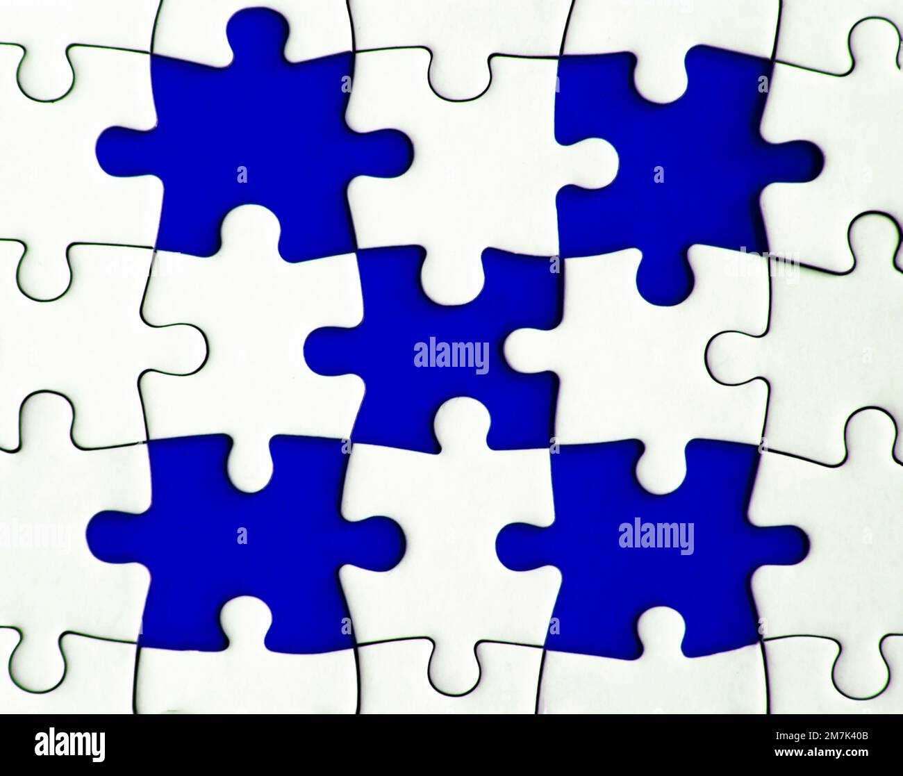 Missing jigsaw puzzle on blue background with customizable space for text or ideas. Copy space. Stock Photo
