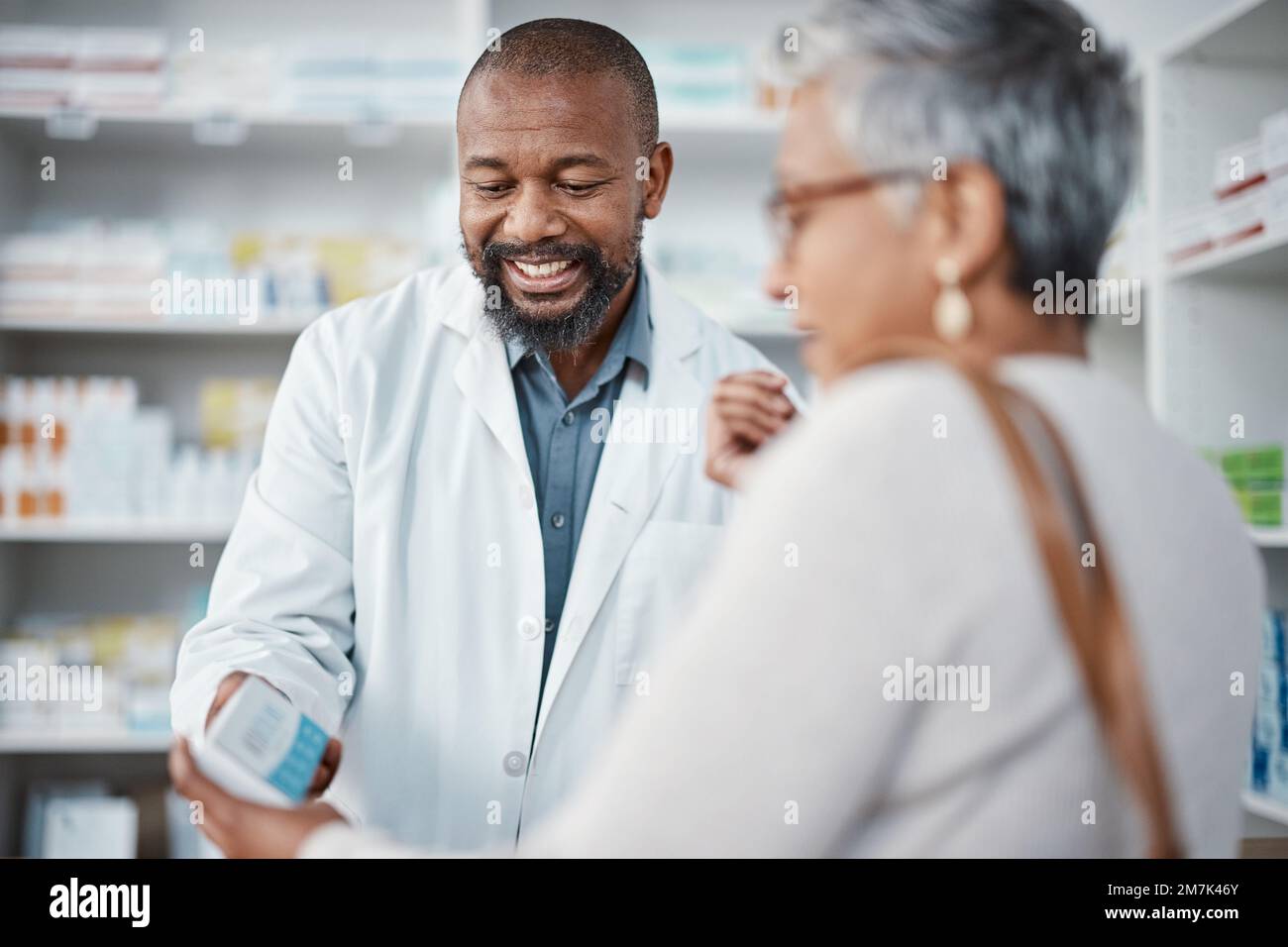 Pharmacy, medicine and senior woman consulting pharmacist on