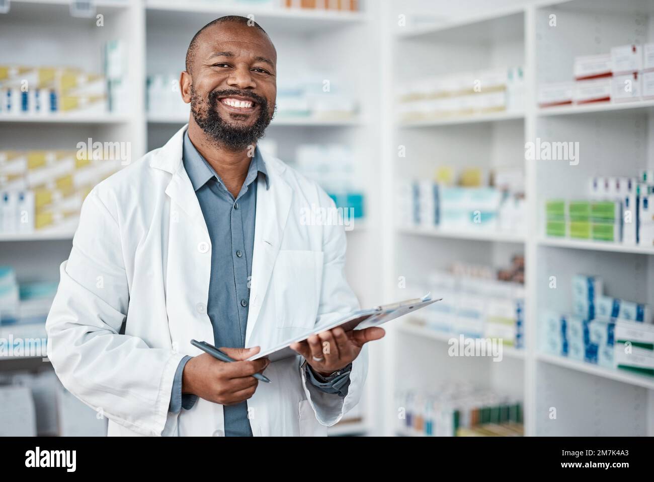 Pharmacy, portrait and black man with clipboard, medicine and pill