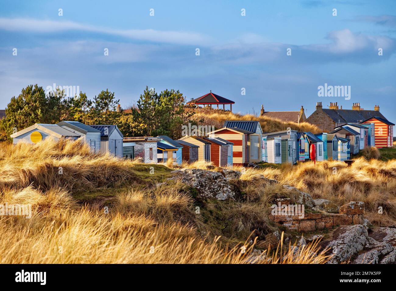 Hopeman village Moray Coast Scotland morning sunlight on grasses and on