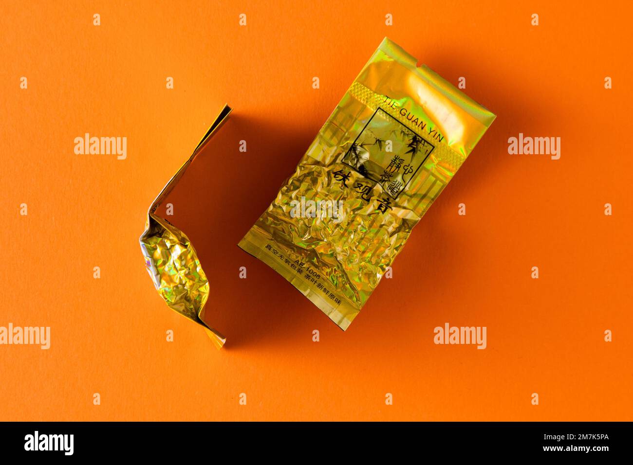 Chinese tea Tie Guan Yin oolong in vacuum packaging. Classic strong tart drink. Gift trial packaging in foil logo. Ukraine, Kyiv - November 25, 2022. Stock Photo