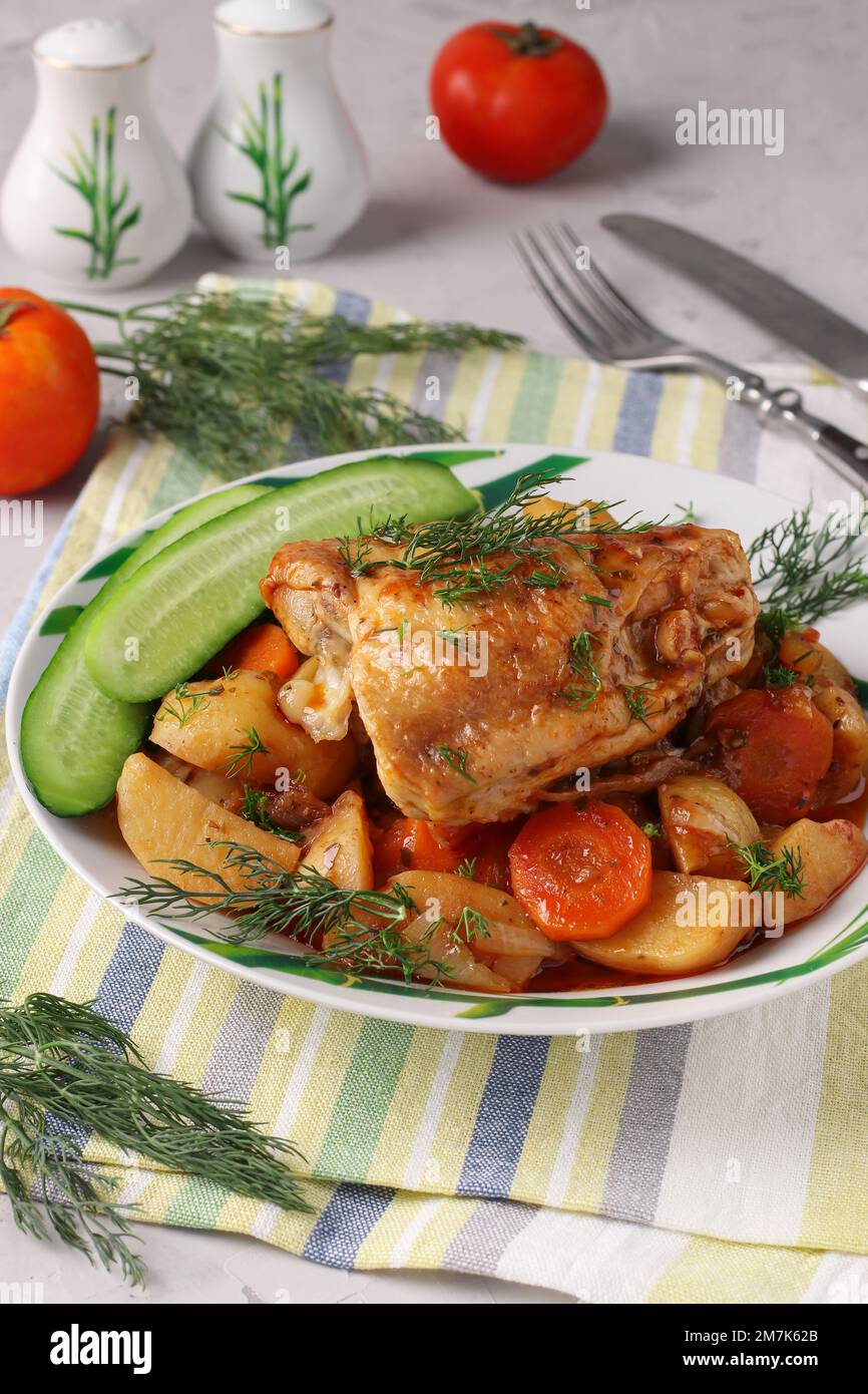 Chicken thighs cooked with potatoes and carrots, Closeup Stock Photo Alamy