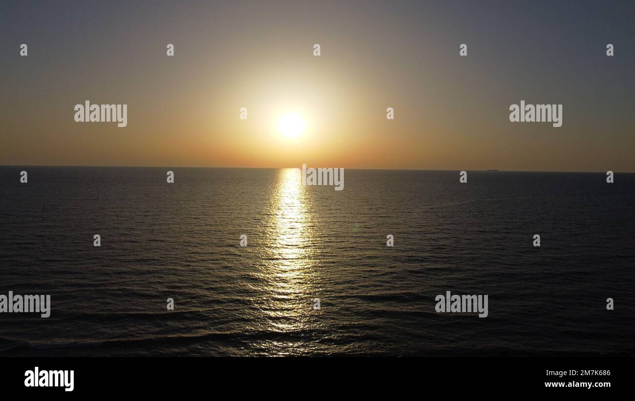 Summer sunset views of the Mediterranean sea. Clear blue sky with aerial capture Stock Photo Alamy
