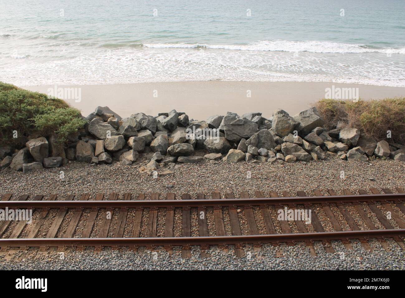 Railroad track along beach route Stock Photo