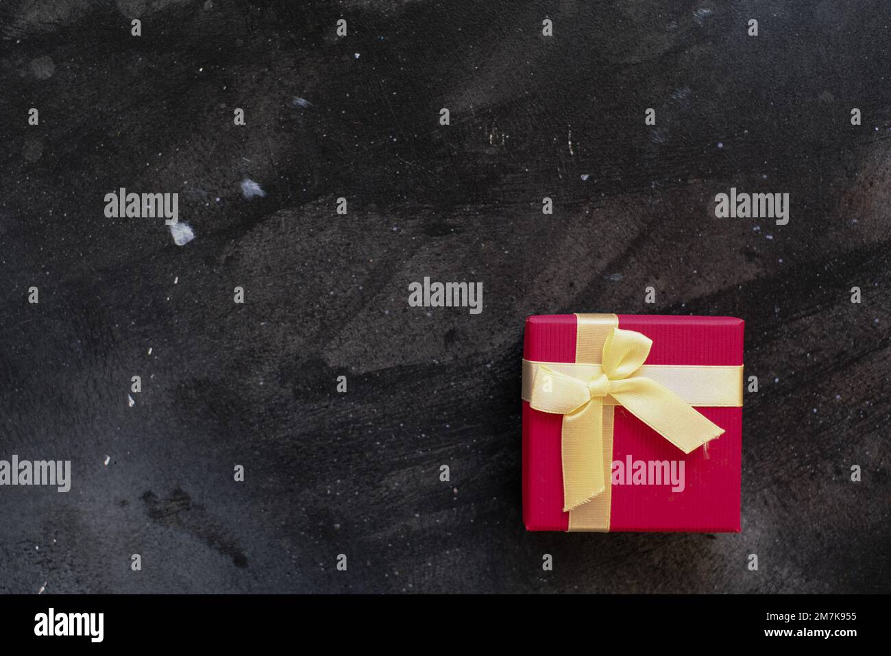Red gift box with a white ribbon on white background Stock Photo - Alamy