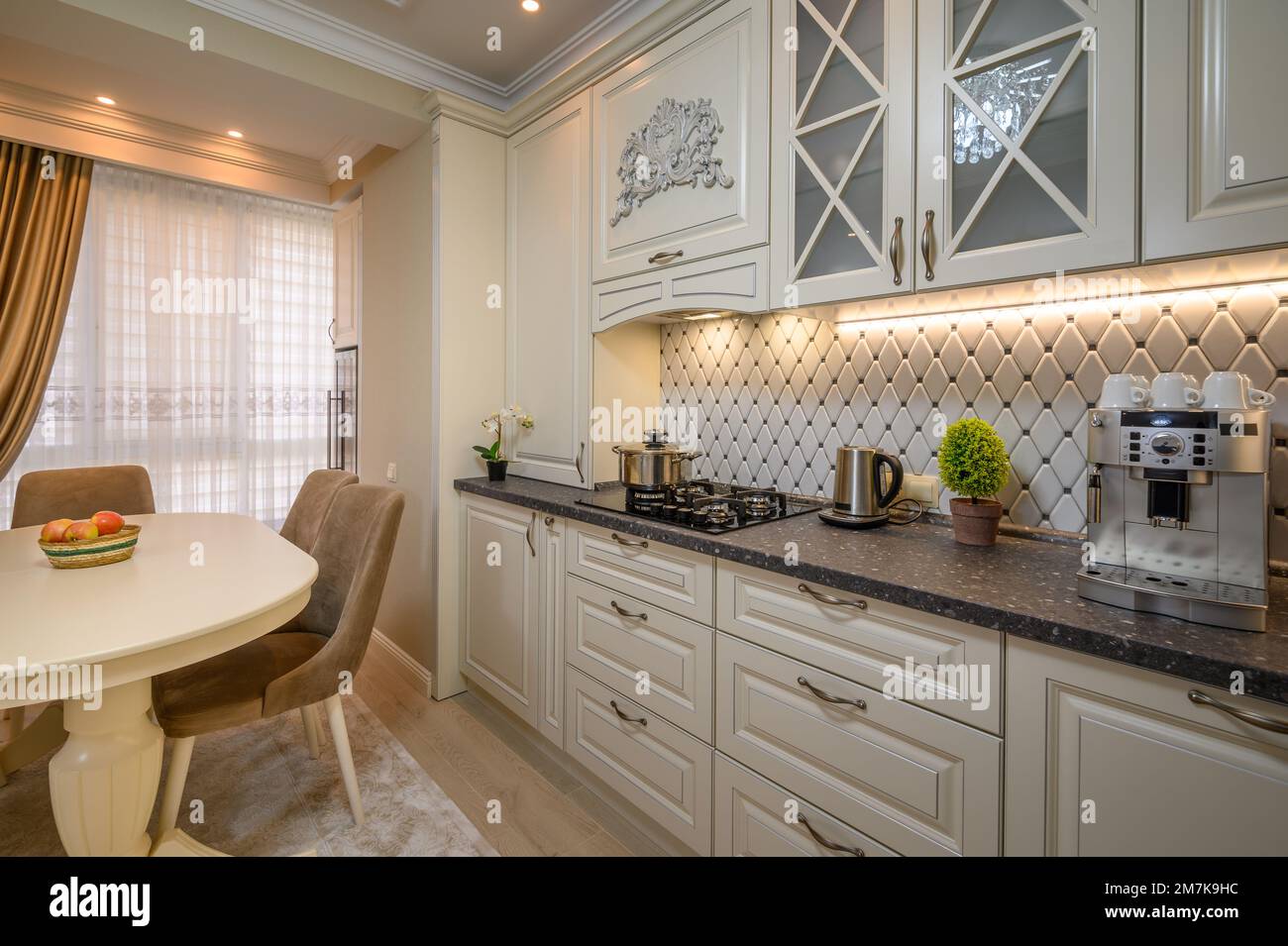 Classic beige spacious kitchen with a classic aesthetic and modern conveniences Stock Photo Alamy