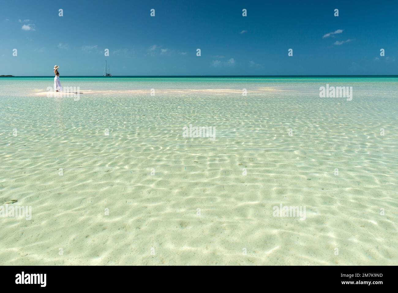 Woman in Eleuthera island lagoon, Bahamas Stock Photo