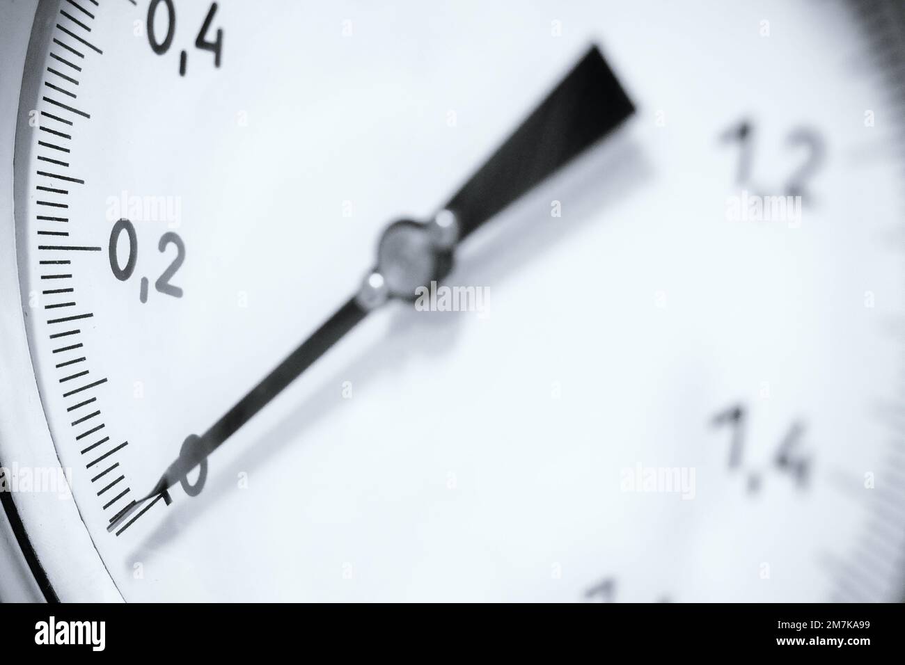 Pressure gauge closeup. Arrow of pressure gauge shows zero on scale