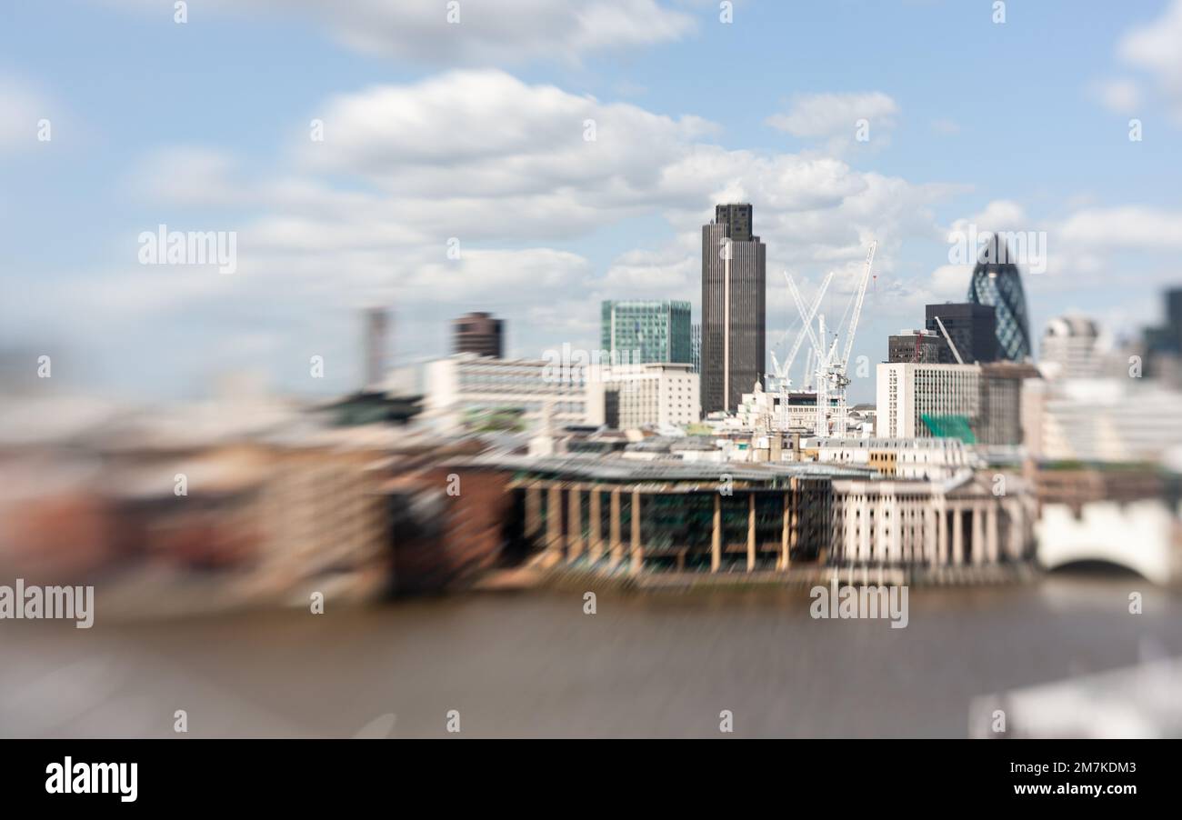 London Skyline abstract. Creative tilt-shift view of the financial City of London district and the River Thames on a bright summers day. Stock Photo