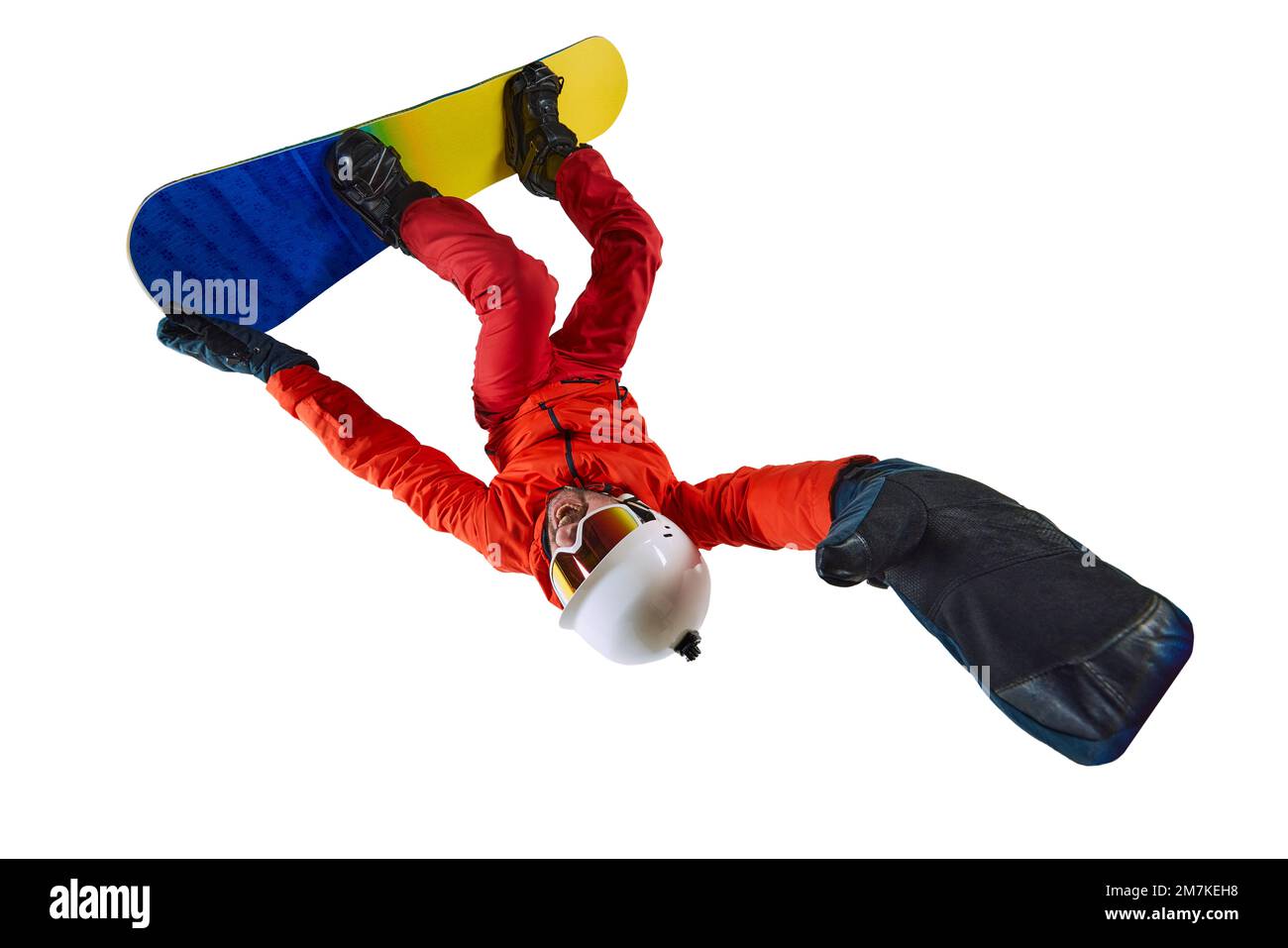 Upside Down trick. Portrait of active man, snowboarder in uniform