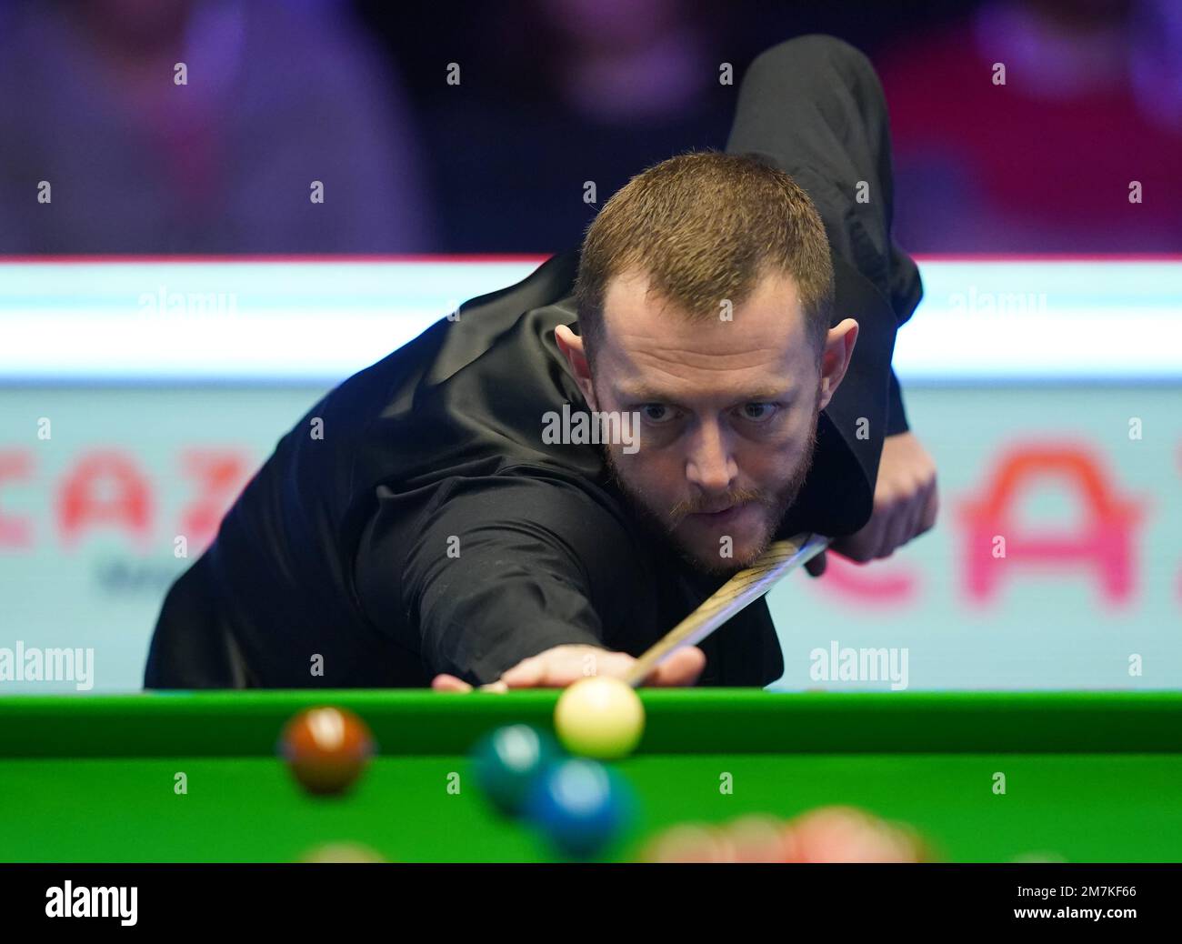 Mark Allen in action against Barry Hawkins during day three of the Cazoo Masters at Alexandra Palace, London