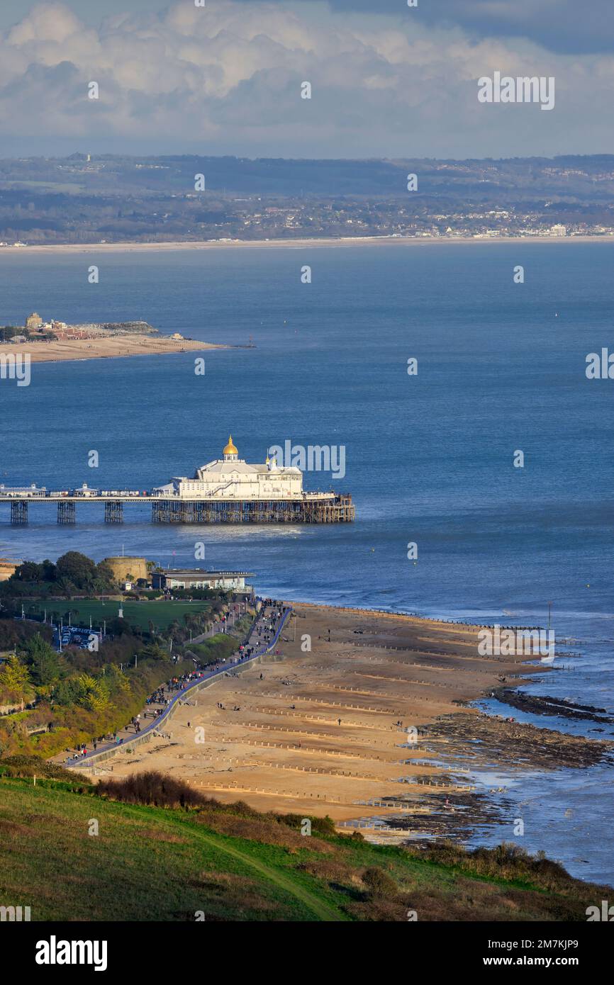 Distant view of Eastbourne Pier with the gold-topped camera obscura roof detail - viewed from Beachy Head looking East. Stock Photo