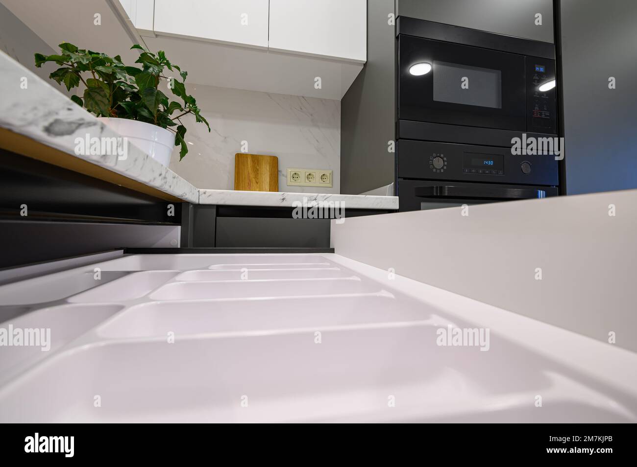 Marble worktop of modern white and dark grey kitchen Stock Photo - Alamy