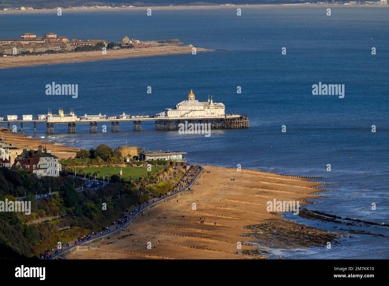 Distant view of Eastbourne Pier with the gold-topped camera obscura roof detail - viewed from Beachy Head looking East. Stock Photo