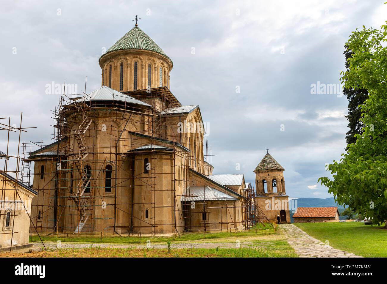 Gelati Monastery, medieval monastic complex near Kutaisi, Georgia founded by King David IV, view with scaffolding during restoration process. Stock Photo