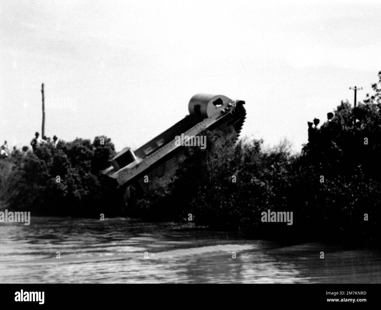 A right side view of the Roebling Alligator tractor as it climbs ashore from the water. The tractor is a Donald Roebling creation and is the vanguard for the present Marine LVTP-7 tracked landing vehicle. State: Florida (FL) Country: United States Of America (USA) Stock Photo