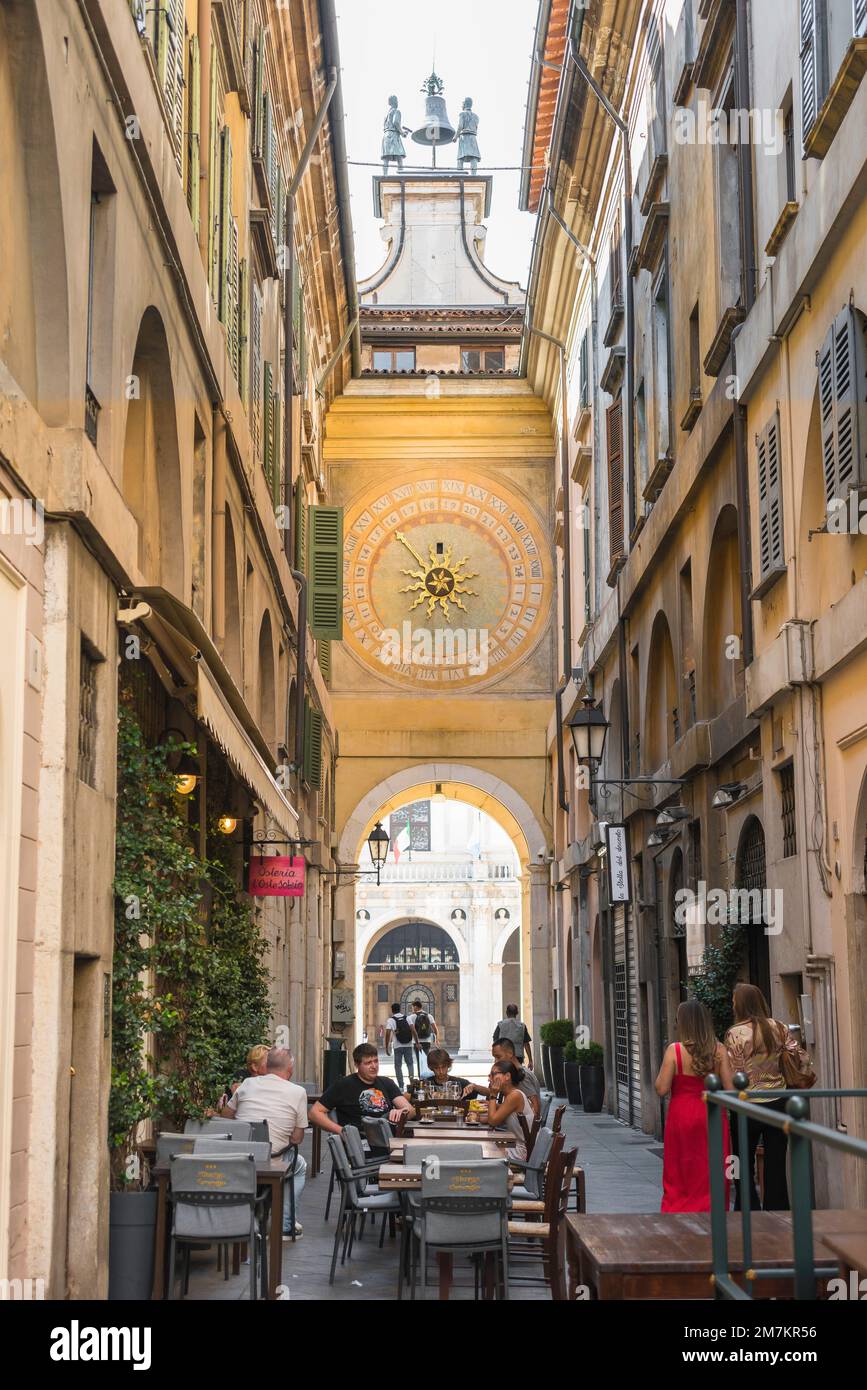 Torre dell'Orologio Brescia, view of the historic astronomical clock sited on the rear of the Torre dell'Orologio seen from the Via Cesare Beccaria Stock Photo