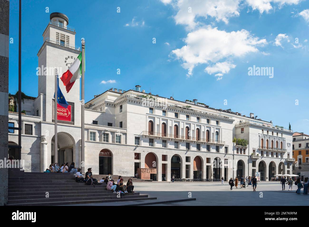 Piazza della Vittoria Brescia, view in summer of buildings flanking the east  side of the monumental Italian fascist civic space (1932) in Brescia Stock Photo