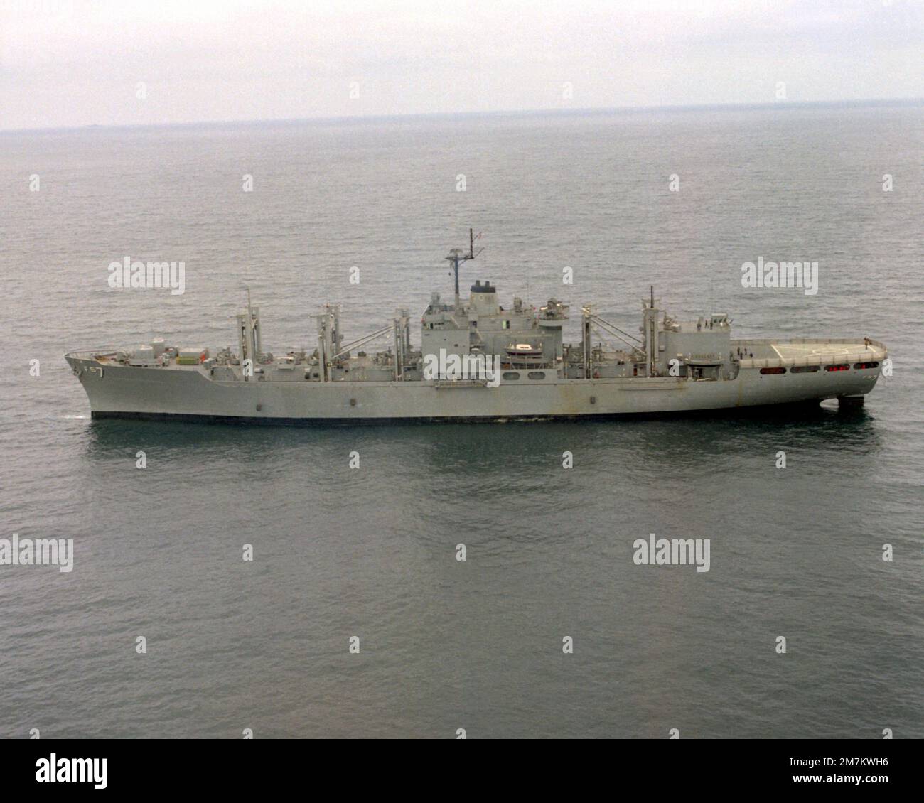 An aerial port beam view of the combat stores ship USS SAN JOSE (AFS-7) off the coast of San Diego. Country: Pacific Ocean (POC) Stock Photo