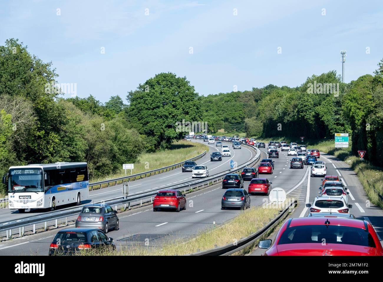Heavy road traffic after the long Ascension weekend in the surroundings of the interchange between the N166 and N24 A roads in Ploermel Breizhgo coach Stock Photo