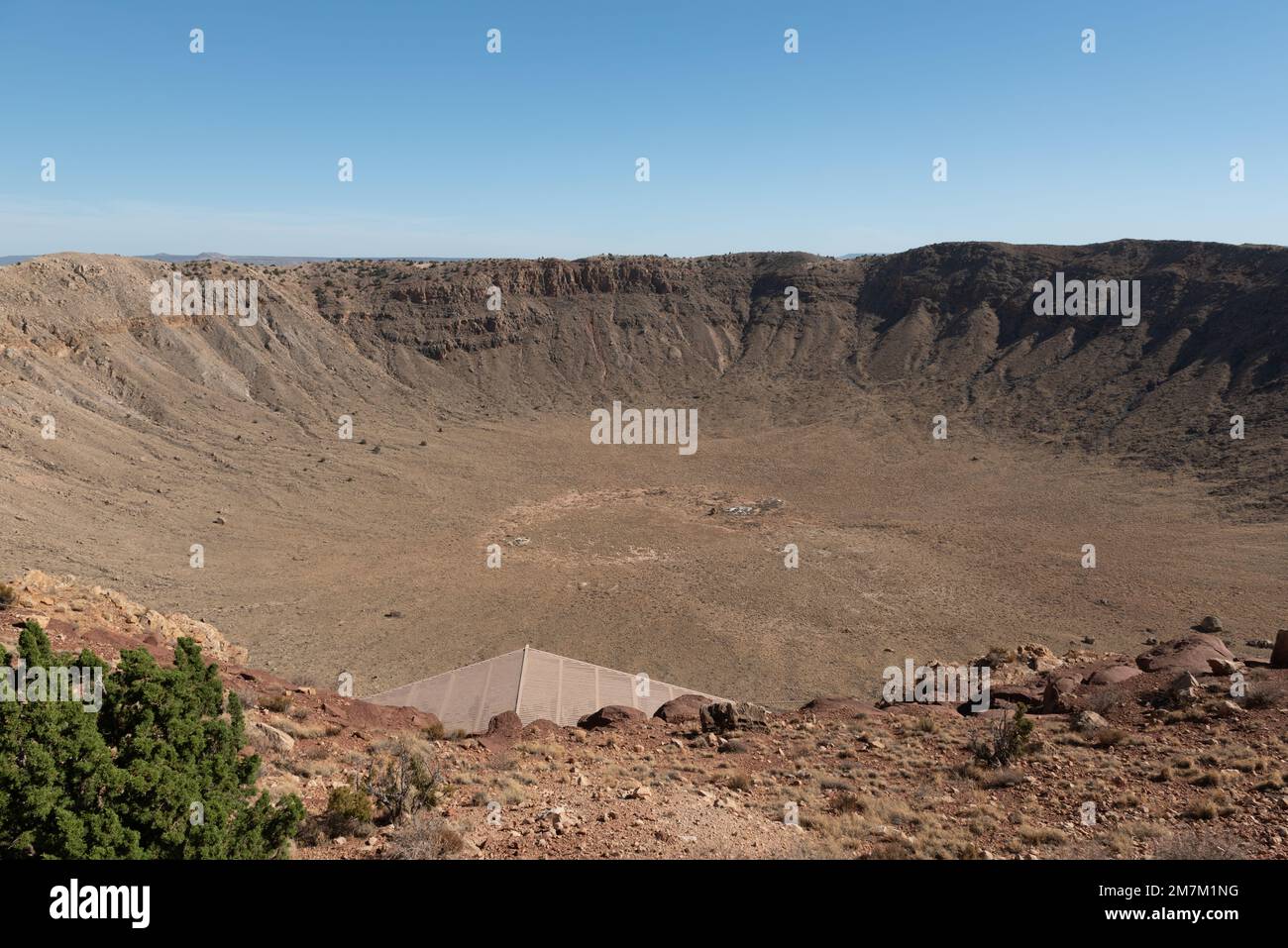 An aerial view of Meteor Crater deserted land on a sunny day Stock Photo