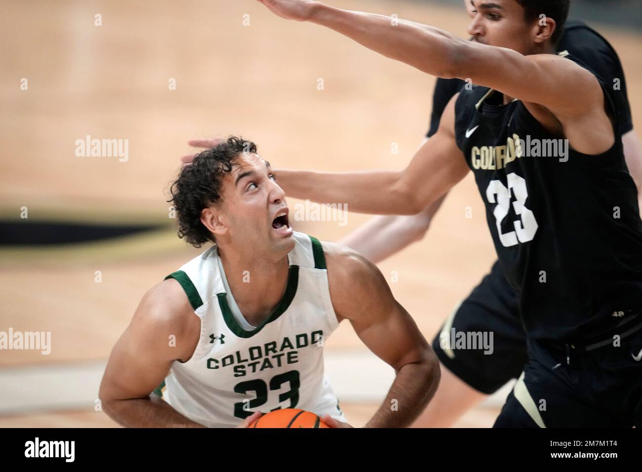 Colorado State guard Isaiah Rivera, left, is defended by Colorado