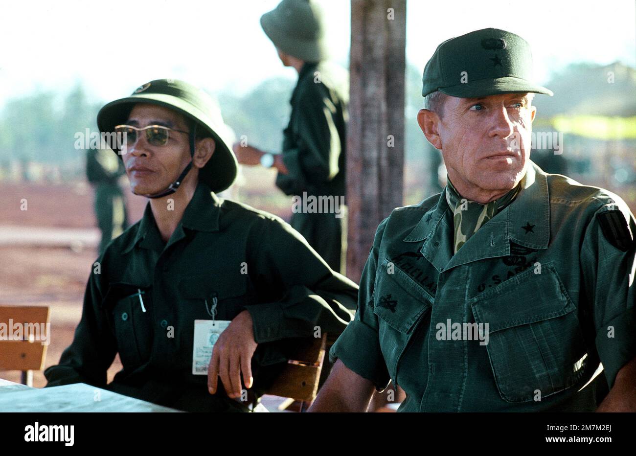 BGEN Stan McClellan, U.S. Army, CHIEF of STAFF, Military Assistance Command - Vietnam (MACV) discusses the pending exchange of American and South Vietnamese prisoners for Viet Cong (VC) and North Vietnamese (NVA)prisoners with Viet Cong officer. Subject Operation/Series: HOMECOMING Base: Loc Ninh Country: South Vietnam Stock Photo