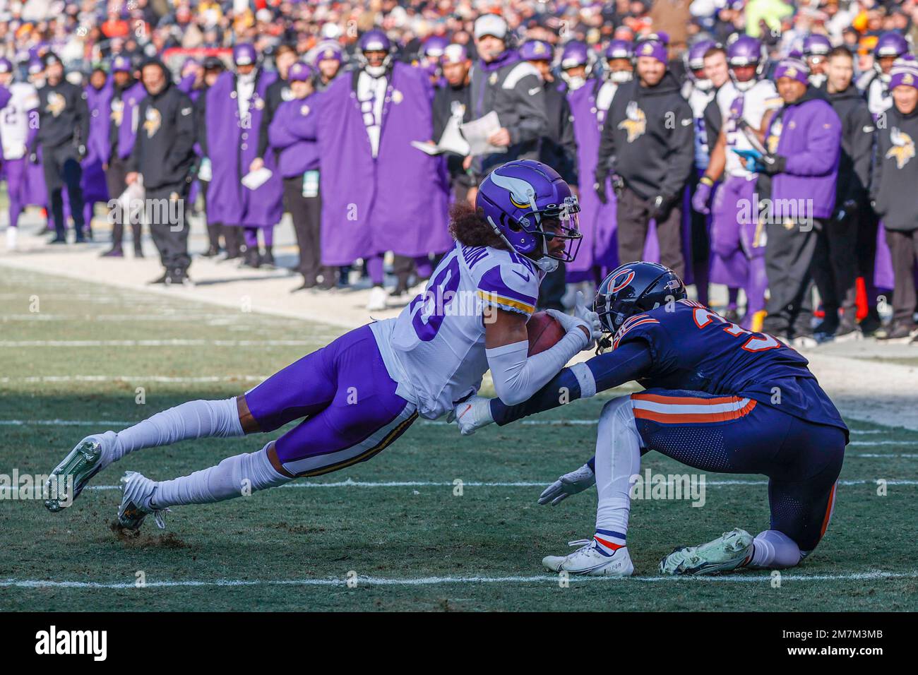 Minnesota Vikings wide receiver Justin Jefferson (18) is tackled by