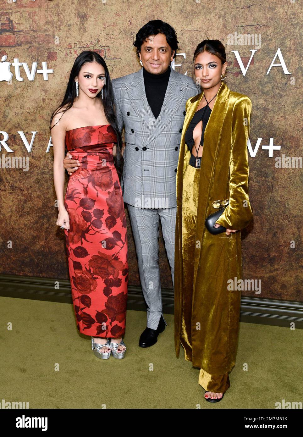 M. Night Shyamalan, center, and daughters Saleka Shyamalan, left, and