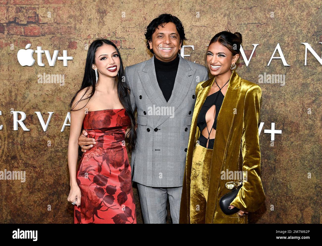 M. Night Shyamalan, center, and daughters Saleka Shyamalan, left, and