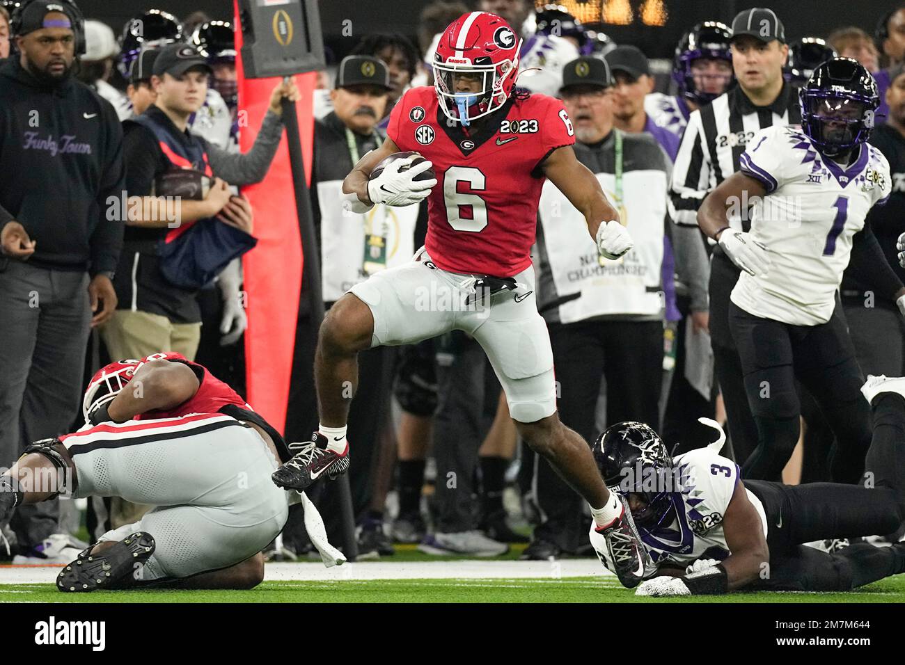 running back Kenny McIntosh (6) runs against TCU during the