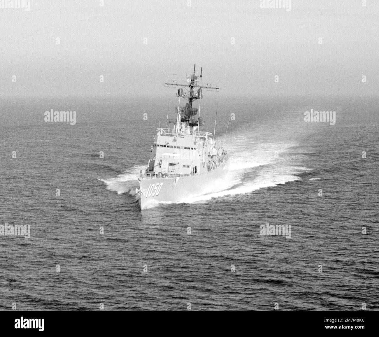 An aerial port bow view of the frigate USS ALBERT DAVID (FF 1050 ...